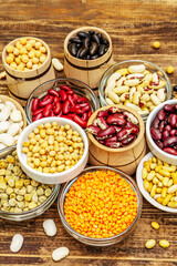 Set of various dry legumes in bowls as indispensable protein for a healthy life