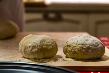 Preparing bread for homemade pizza, an Italian tradition