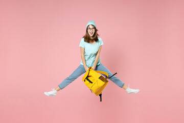 Full length portrait of excited young woman student in t-shirt hat glasses hold backpack jumping...
