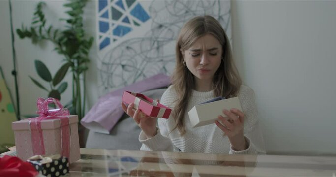Woman opens present gift