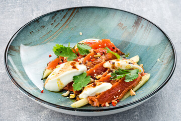 Salmon tiradito with coriander. Asian food.