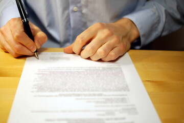 Businessman is signing a document