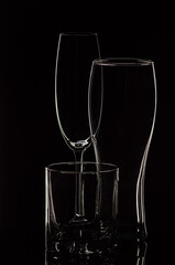 set with different empty glasses on black background - champagne,cocktail,wine,brandy,whiskey,scotch,vodka,cognac