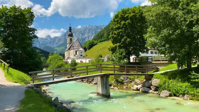 Scenic mountain landscape in the Bavarian Alps with famous Parish Church of St. Sebastian in the village of Ramsau, Nationalpark Berchtesgadener Land, Upper Bavaria, Germany
