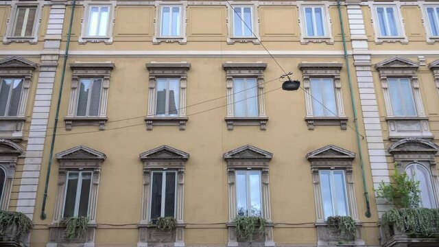 Italy , Milan January 2021 - Semi empty street in downtown during Covid-19 Coronavirus lockdown quarantine home - classic historic facade of italian building in Conciliazione district