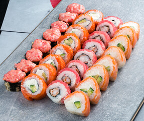 Different kinds of sushi roll. Japanese food set of different sushi rolls on a plate