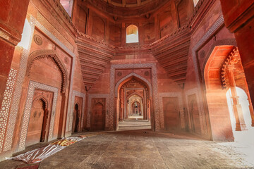 Fatehpur Sikri medieval Mughal architecture built of red sandstone with intricate ancient wall art at Agra, India