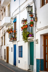 Fototapeta na wymiar street in traditional village of lanjaron, spain, andalusia, colourful doors