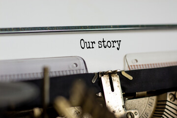 Our story symbol. Words 'Our story' typed on retro typewriter. Business and our story concept. Copy space.