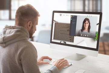 Freelancer communicates with the employer online. Work desk with modern computer. Work at home  concept.
