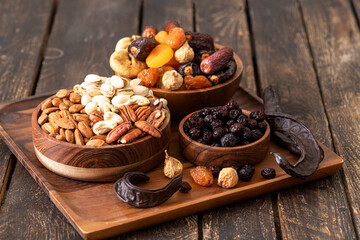 Mix from dried fruits and nuts in a bowl. Healthy food. Symbols of judaic holiday Tu Bishvat