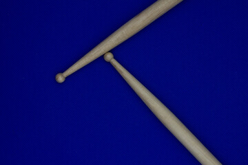 Percusions drumsticks  on blue, musical concept, longing for concerts
