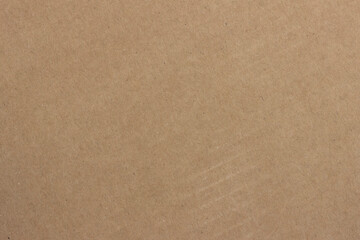 Fototapeta na wymiar The surface structure of light brown cardboard.