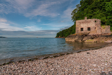 The disused bath-house at Elberry Cove, Torbay, England, UK