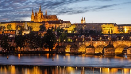 Charles Bridge over the Vltava River in Prague with castle in the background.