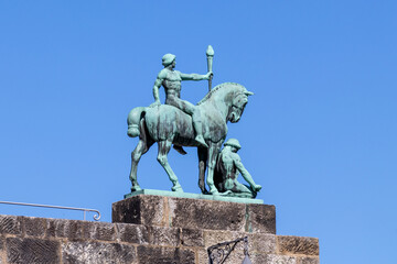 Equestrian statue on the Veste Coburg against blue sky