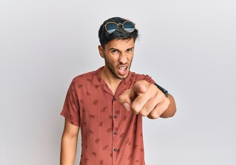 Young handsome man wearing casual summer clothes pointing displeased and frustrated to the camera, angry and furious with you