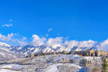 Spectacular views in Highland Utah with houses nestled on snowy mountain slope