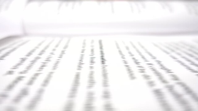 Abstract effect of unreadable example text sliding to the left. Concept of big data and information flowing. Horizontal close up of the never-ending book. Blurred motion effect.
