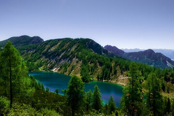 Fototapeta na wymiar amazing blue lake in the mountains on summer vacation