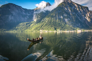 fishing boat on mountain lake, hallstatt, austria