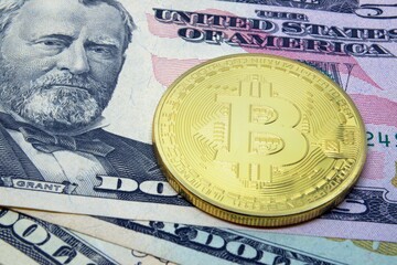 Bitcoin coin on the background of dollars. Virtual cryptocurrency concept. BTC vs USD.