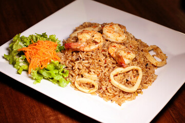 Colombian food seafood rice, shrimp, salad