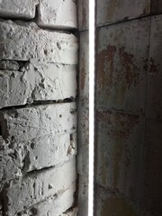  Gray brick wall. Led lighting. Corner composition