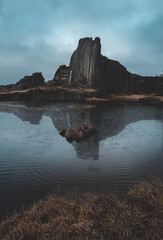 Lake with one of the most famous monuments of the Czech Republic Mansion Rock (basalt columns)