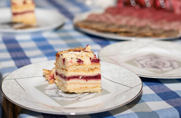 a piece of cake with raspberries on a plate.