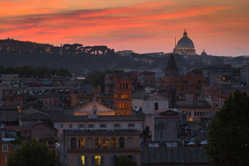 Panoramic colorful view of Rome at sunset City skyline with Saint Peter Basilica in the background in a summer evening, Rome, Italy