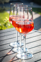3 glasses of rosé wine, summer party, sunshine, happiness