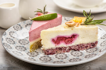 Two pieces of raw food cake on a plate.