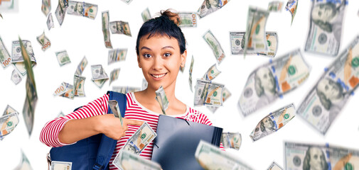 Obraz premium Young woman wearing student backpack holding binder pointing finger to one self smiling happy and proud