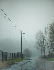 Puddled street in cloudy weather.NEF