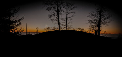 Fototapeta premium Sunrise with inverse and silhouette of trees near Plechy hill