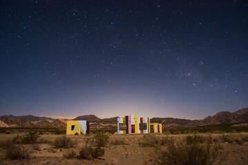 Starry night sky over a derelict house in the middle of the desert near Uspallata, Mendoza,...