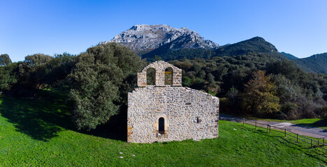View from a drone of the ruins of the hermitage of San Julian in the Liendo Valley in Cantabria,...