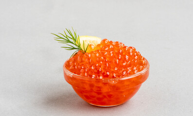 A full bowl of fresh red salmon caviar. Traditional Russian appetizer