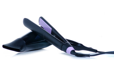 Hair straightener iron and hair dryer on white background isolation