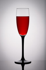 A glass of red wine on a white background