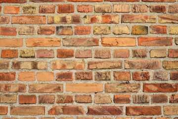 Fototapeta premium Mauer mit roten Steinen als Hintergrund