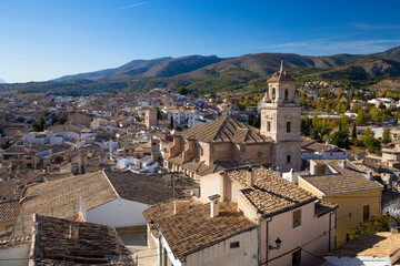 Fototapeta na wymiar Panorama of the city of Caravaca de la Cruz with many houses with tiled roofs, a place of pilgrimage near Murcia in Spain.