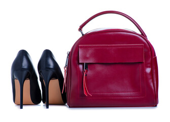 Naklejka premium Woman red bag and black high heel shoes on white background isolation