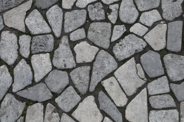 Background of stones. Empty background. The road is paved with stones