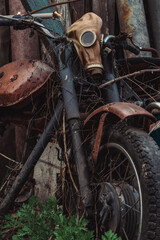 Fototapeta na wymiar old gas mask on a motorcycle
