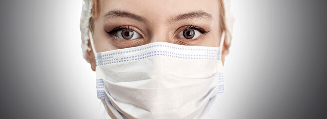 Coronavirus concept. Girl wearing a protective medical mask. Protect your health. Stop the virus and pandemic covid-19. White background.
Doctor wearing protection face mask against coronavirus. Banne