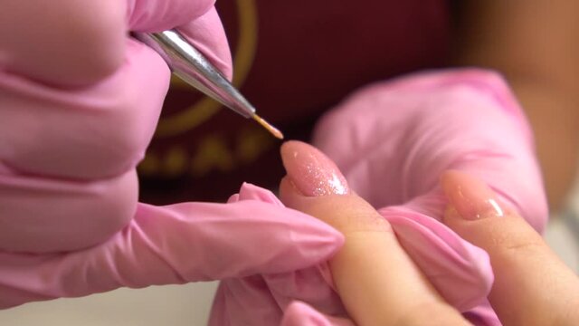 Female Hands Manicure Close-Up View. Aged Lady Hand At Manicure pink Procedure