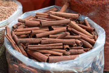 Cinnamon sticks in a plastic bags at bazaar.