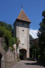 Fototapeta na wymiar The medieval Passeirer Tor city gate with segmental arch in the old town of Merano in South Tyrol Italy